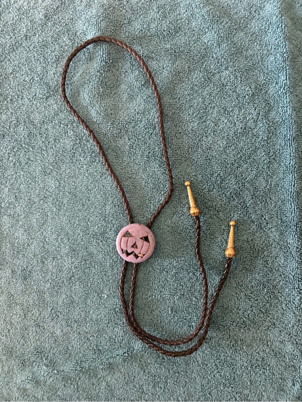Brown Braided Bolo Tie with Purple Jack-o'-Lantern Slide